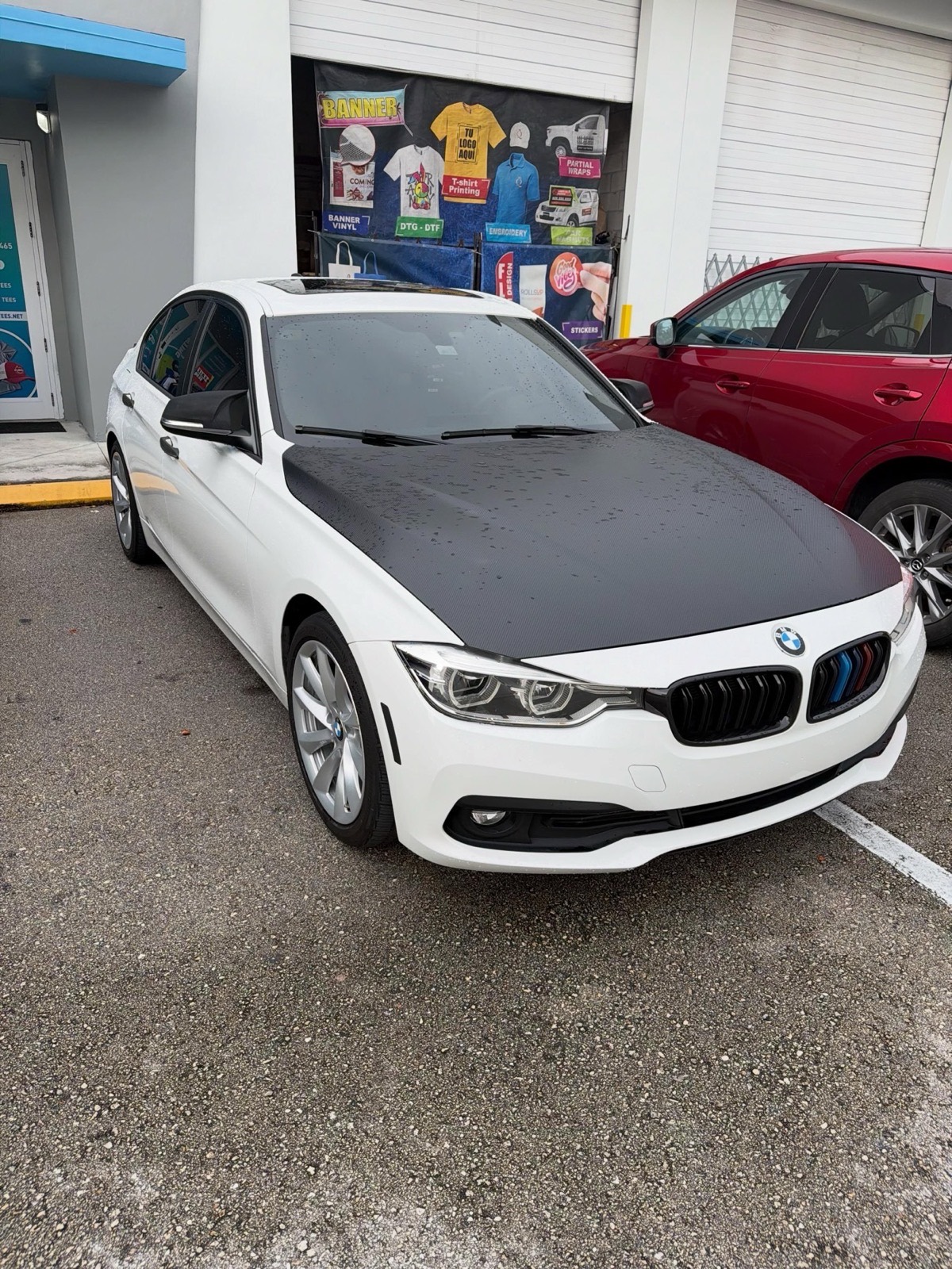 Front view of the restored BMW, paint clean and glossy