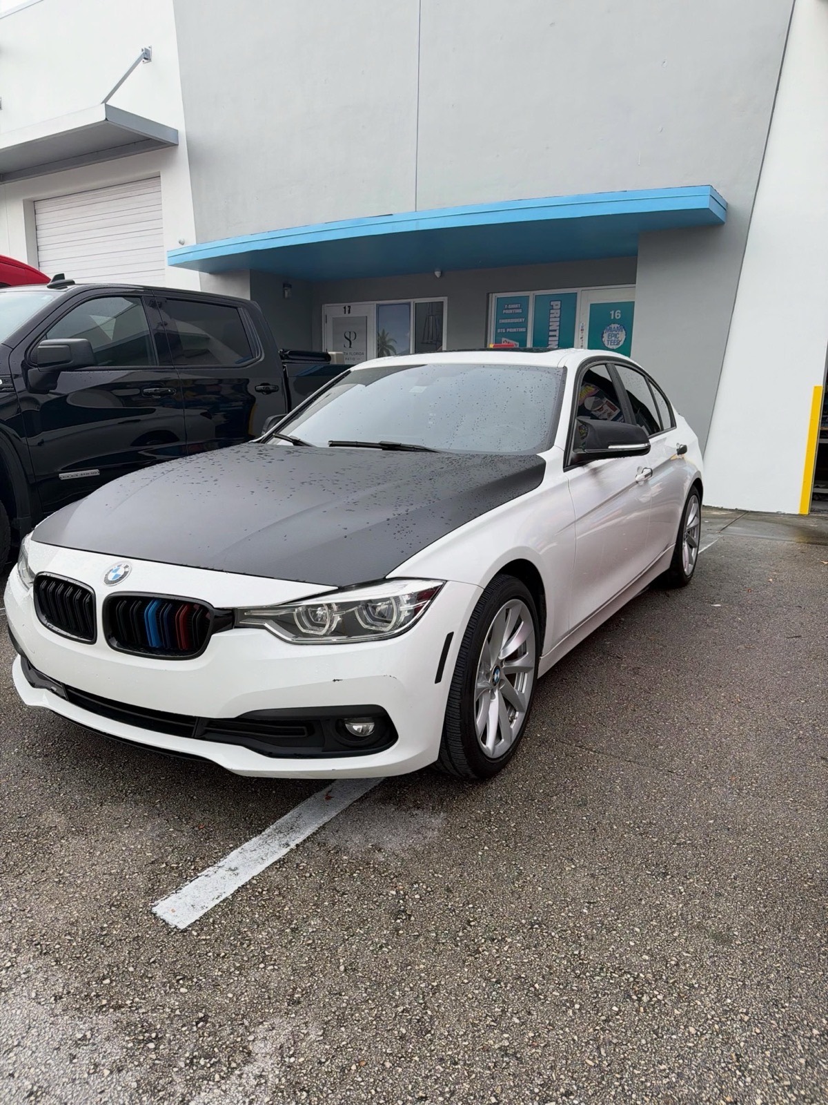 The same BMW clean and glossy after detailing