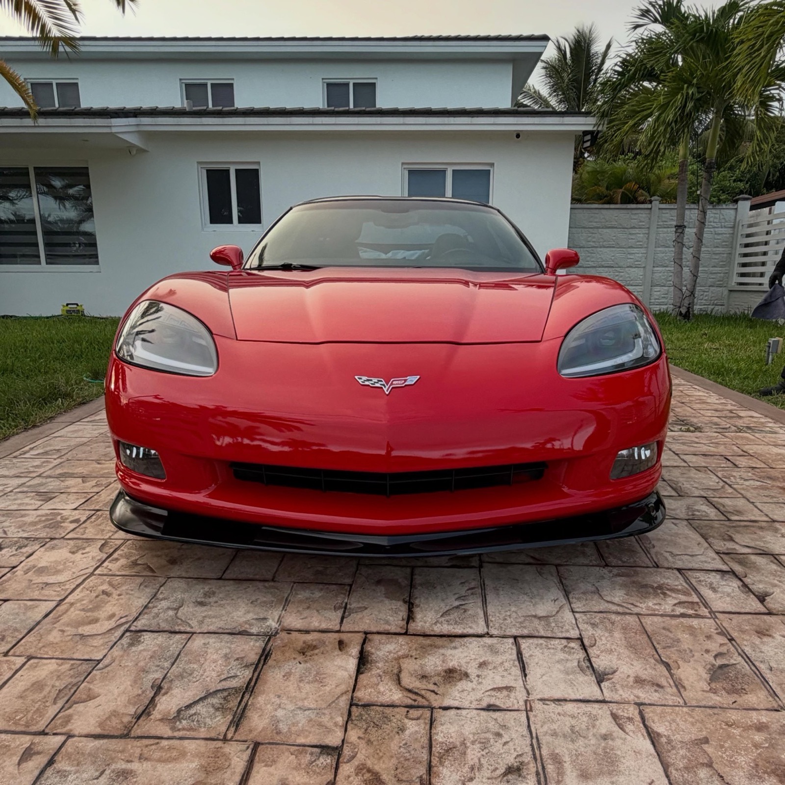 Front three-quarter view of a detailed red Corvette