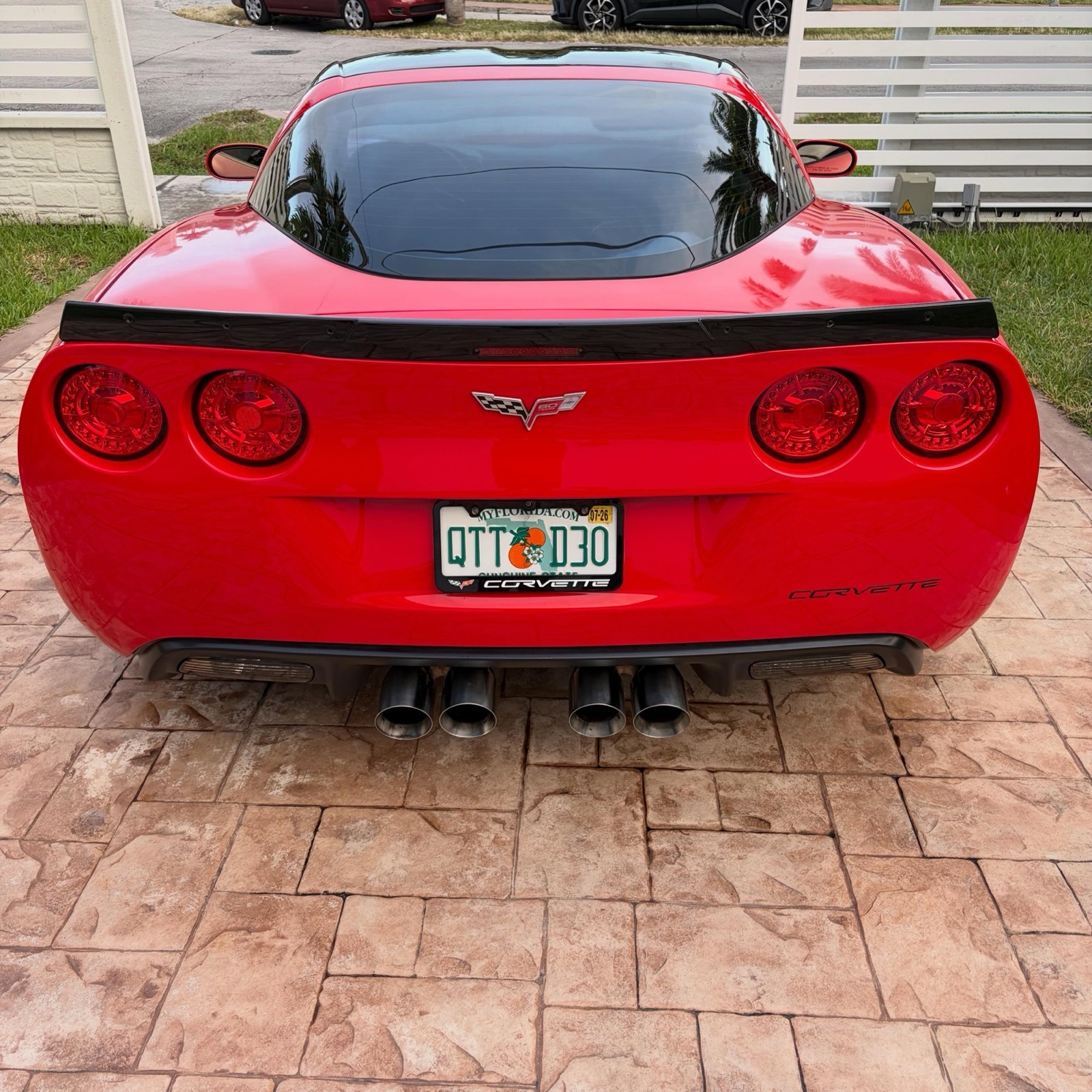 Rear three-quarter view of a detailed red Corvette